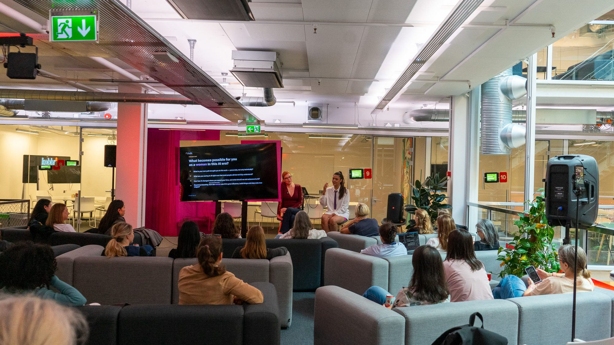 A Be Possible event room with women gathered for a live conversation