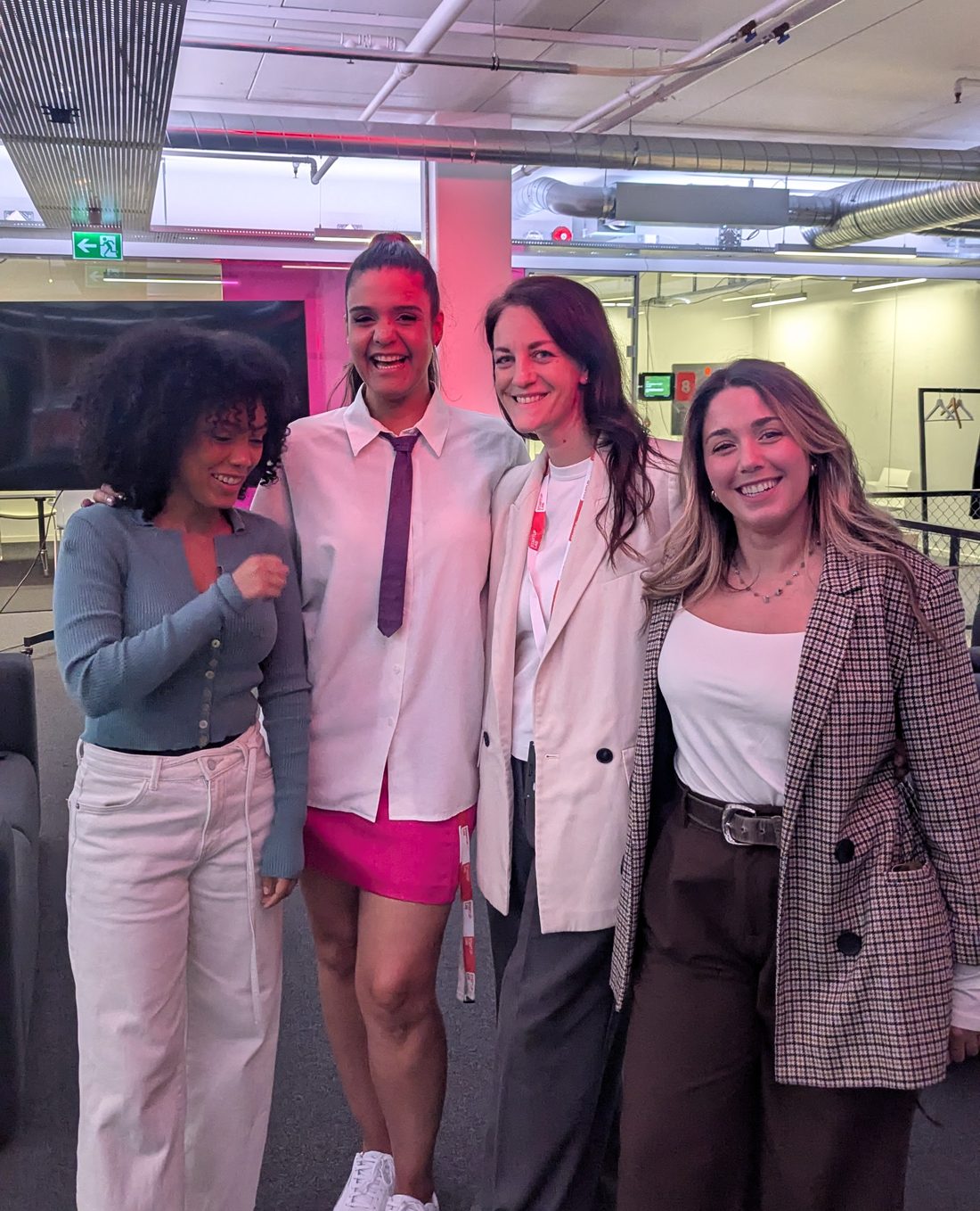 Four women together at a Be Possible event